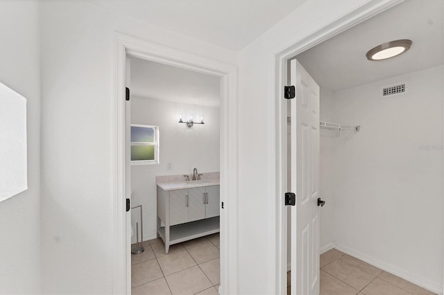 bathroom featuring vanity and tile patterned flooring