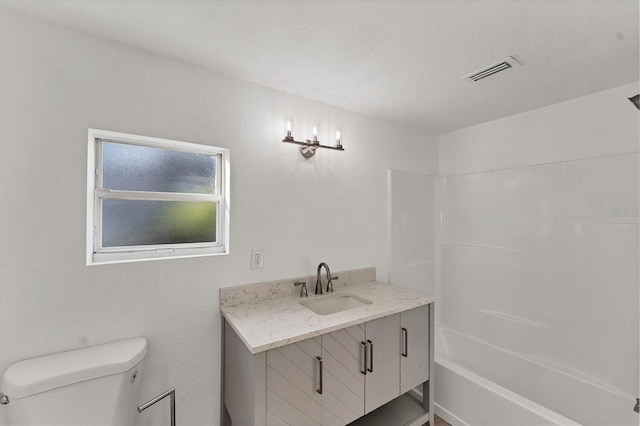 full bathroom featuring vanity, shower / bathing tub combination, and toilet