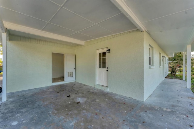 doorway to property with a patio