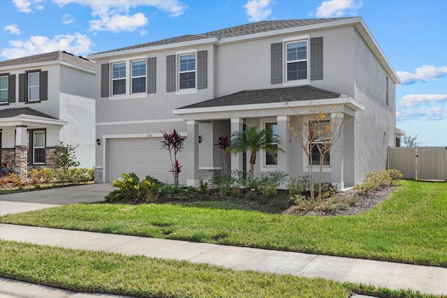 view of front facade featuring a garage and a front yard