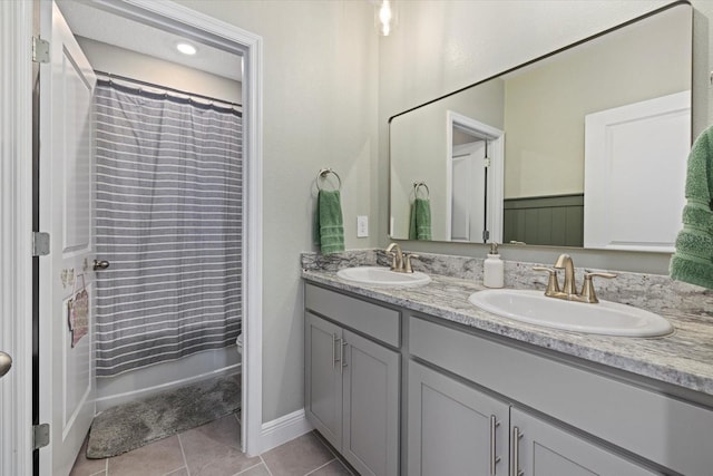 bathroom with tile patterned flooring, vanity, and shower / tub combo with curtain