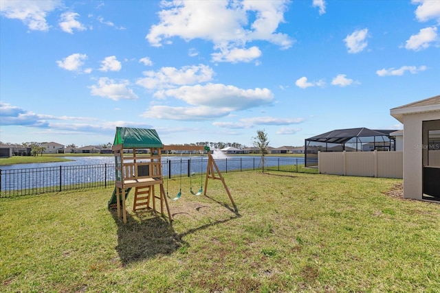 view of yard with a playground and a water view