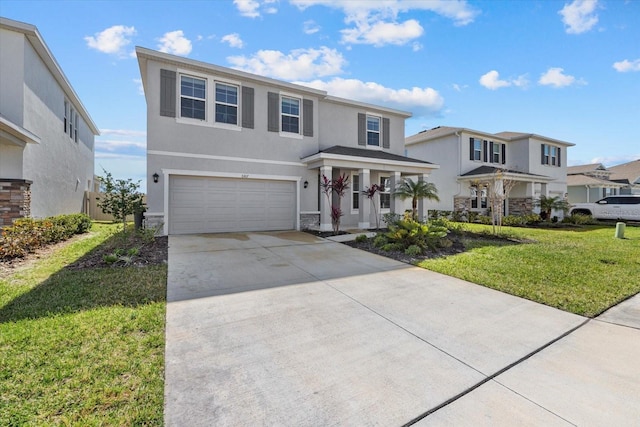 front of property featuring a garage and a front lawn