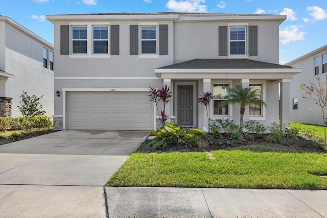 view of front of home with a garage and a front yard