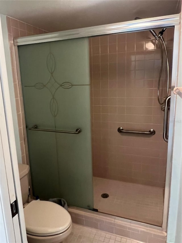 bathroom with walk in shower and toilet