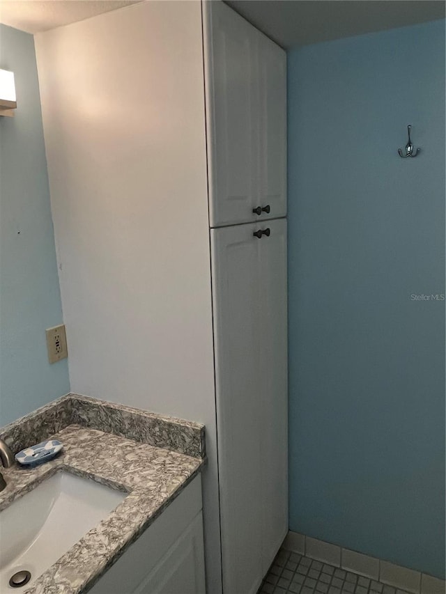 bathroom with vanity and tile patterned floors