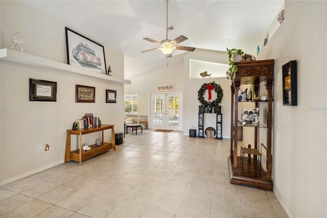 interior space with light tile patterned floors, high vaulted ceiling, and french doors