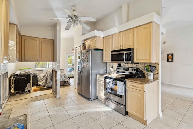 kitchen featuring appliances with stainless steel finishes and light brown cabinetry