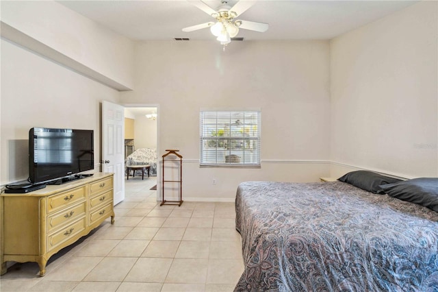 bedroom with ceiling fan and light tile patterned floors