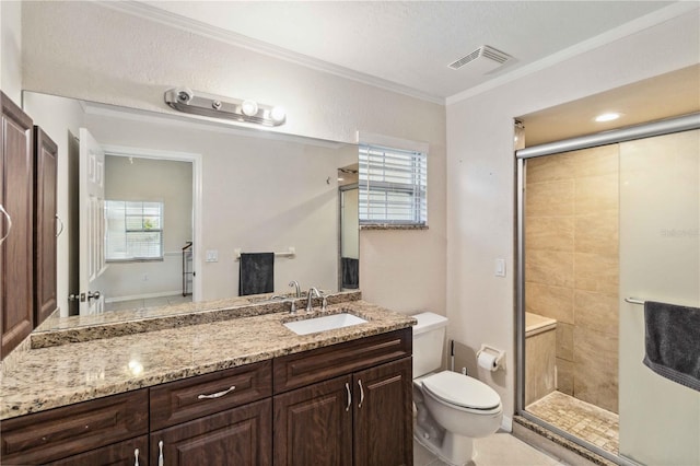 bathroom with vanity, a shower with shower door, ornamental molding, and toilet