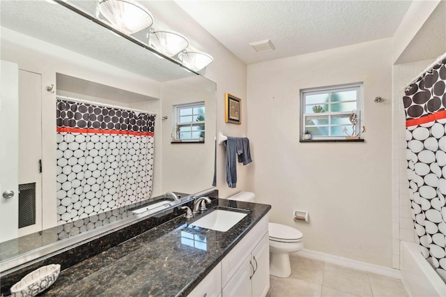 full bathroom with vanity, tile patterned flooring, plenty of natural light, and toilet