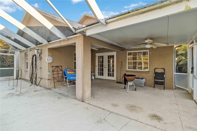 view of patio with french doors and ceiling fan