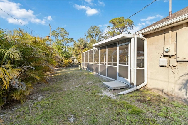 view of yard with a sunroom