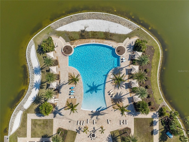 view of swimming pool with a water view