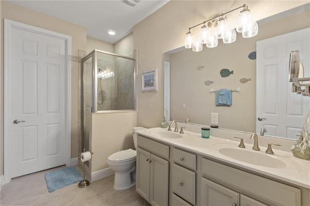 bathroom featuring tile patterned floors, toilet, an enclosed shower, and vanity