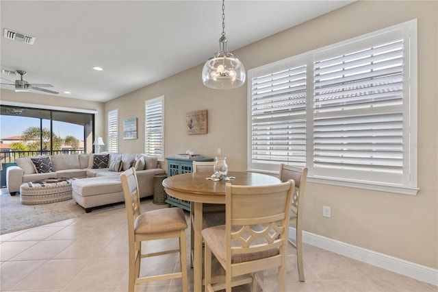 tiled dining room with ceiling fan