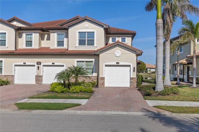 mediterranean / spanish-style home featuring a garage