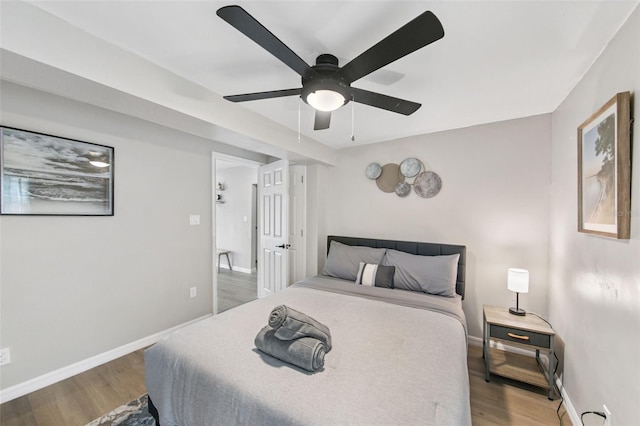 bedroom featuring hardwood / wood-style floors and ceiling fan