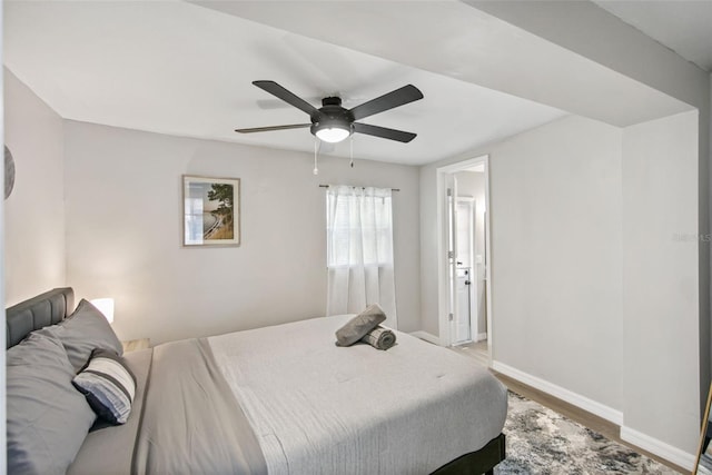 bedroom featuring hardwood / wood-style floors and ceiling fan