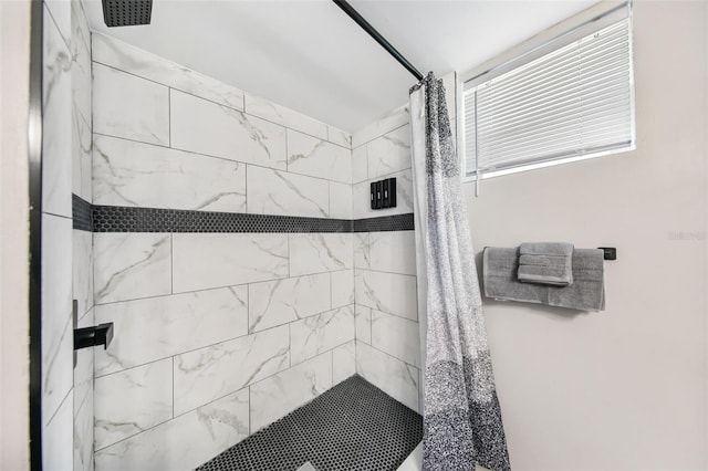 bathroom with a shower with shower curtain