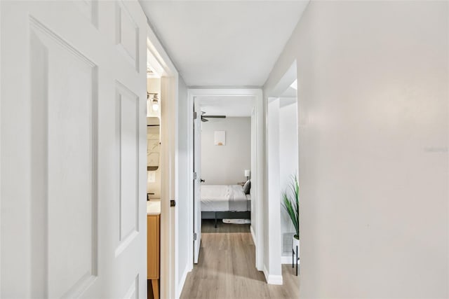 corridor featuring light hardwood / wood-style floors