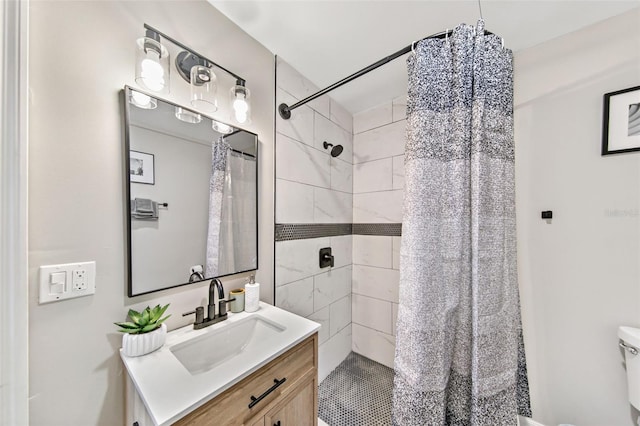 bathroom featuring vanity, a shower with curtain, and toilet