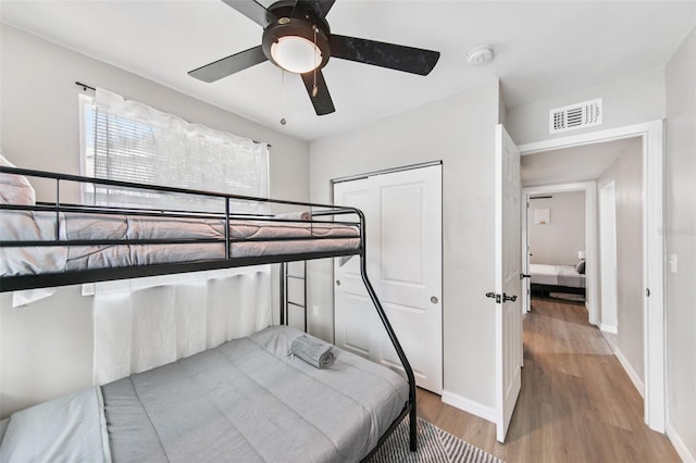 bedroom featuring light hardwood / wood-style flooring and ceiling fan