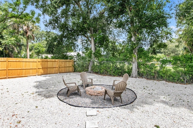 view of patio / terrace featuring an outdoor fire pit