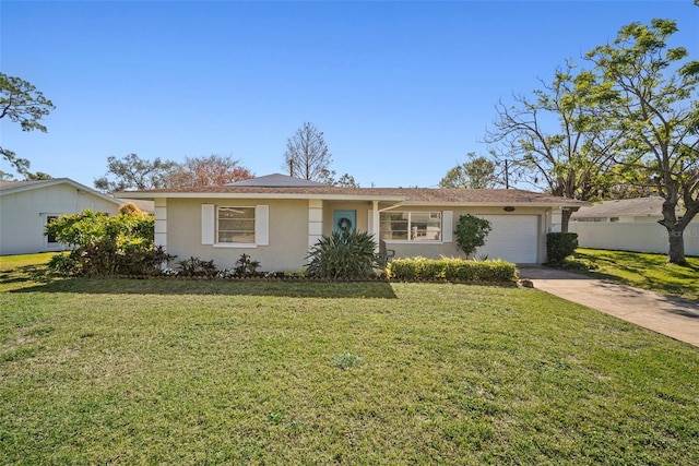 ranch-style house featuring a garage and a front yard