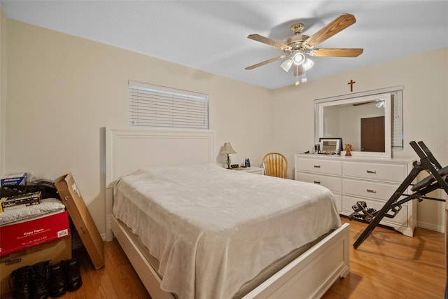 bedroom featuring wood-type flooring and ceiling fan