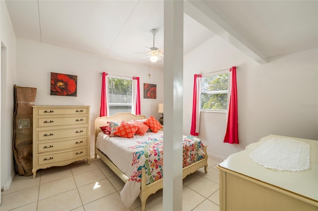 bedroom with light tile patterned flooring, ceiling fan, and beamed ceiling