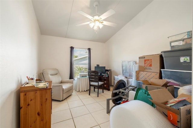 office area with vaulted ceiling, ceiling fan, and light tile patterned flooring