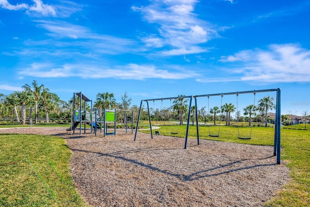 community jungle gym featuring a lawn