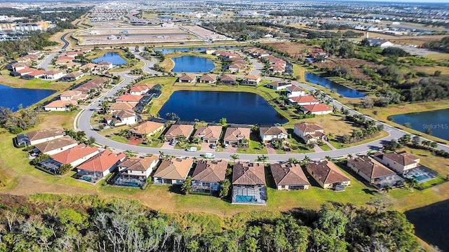 bird's eye view with a water view and a residential view