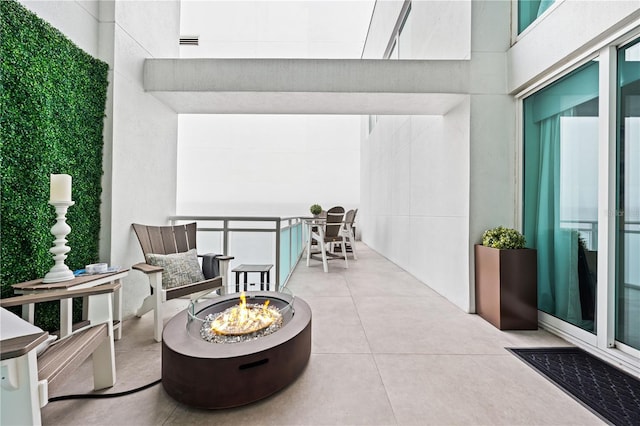 view of patio with visible vents and a fire pit