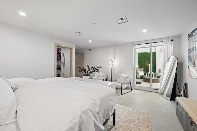 bedroom featuring access to outside, visible vents, finished concrete flooring, and recessed lighting