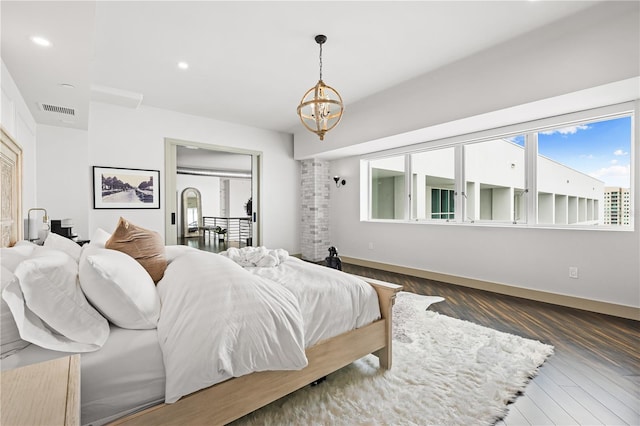 bedroom with a chandelier, recessed lighting, visible vents, baseboards, and dark wood-style floors