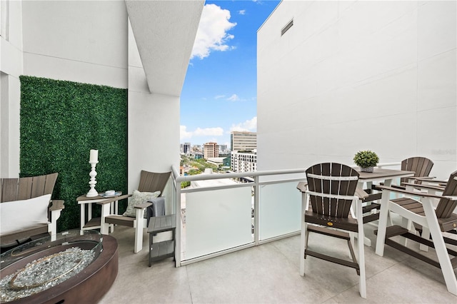 balcony with an outdoor fire pit