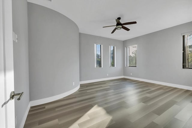 spare room featuring hardwood / wood-style flooring and ceiling fan