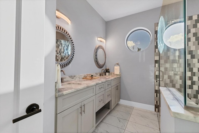 bathroom featuring vanity and a shower with door