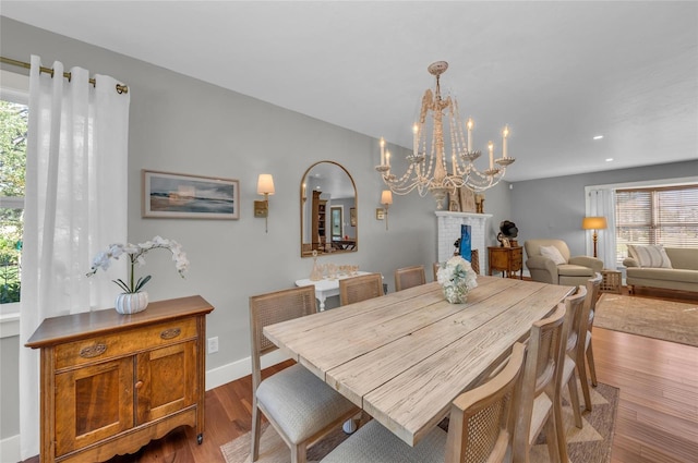 7820 Seville Cir, Bradenton, FL 34209 - dining space featuring wood finished floors, a chandelier, recessed lighting, and baseboards