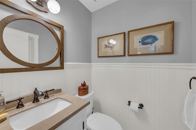 7820 Seville Cir, Bradenton, FL 34209 - half bath with wainscoting, toilet, and vanity