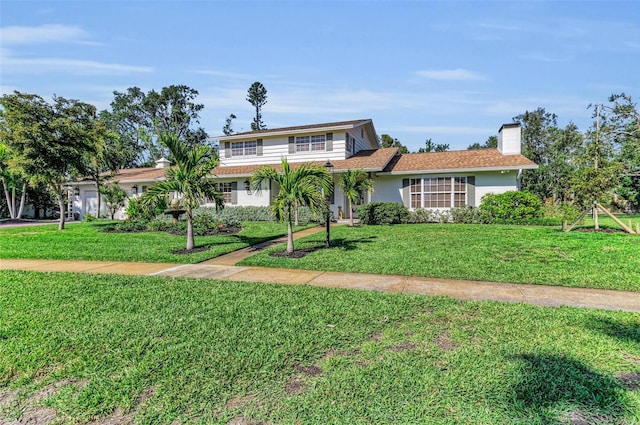 7820 Seville Cir, Bradenton, FL 34209 - traditional-style home featuring a front lawn and a chimney