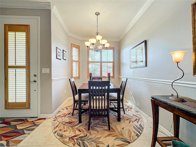 dining room with an inviting chandelier, light tile patterned floors, baseboards, and ornamental molding