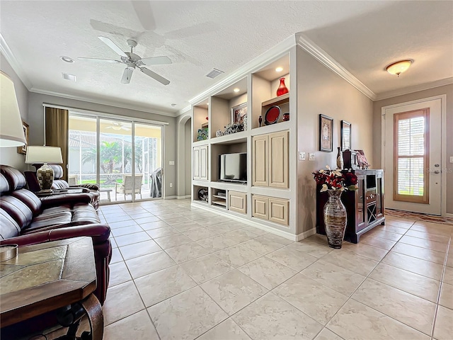 living area with visible vents, built in shelves, ornamental molding, a textured ceiling, and light tile patterned floors