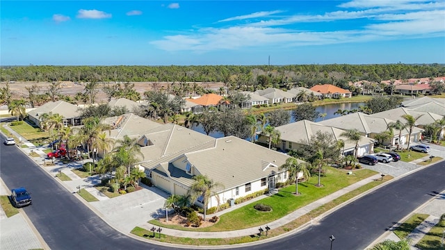 bird's eye view with a residential view and a water view