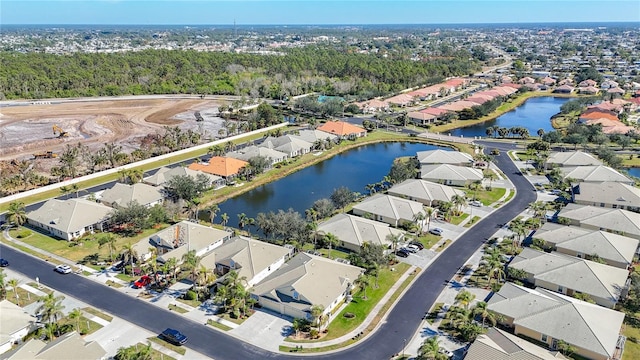 bird's eye view featuring a residential view and a water view