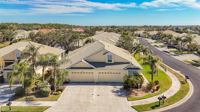 birds eye view of property with a residential view