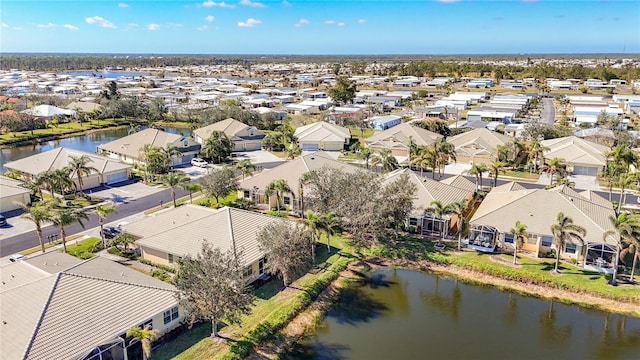 birds eye view of property with a residential view and a water view