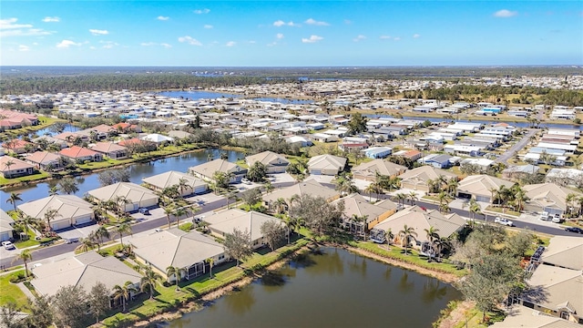 aerial view with a residential view and a water view